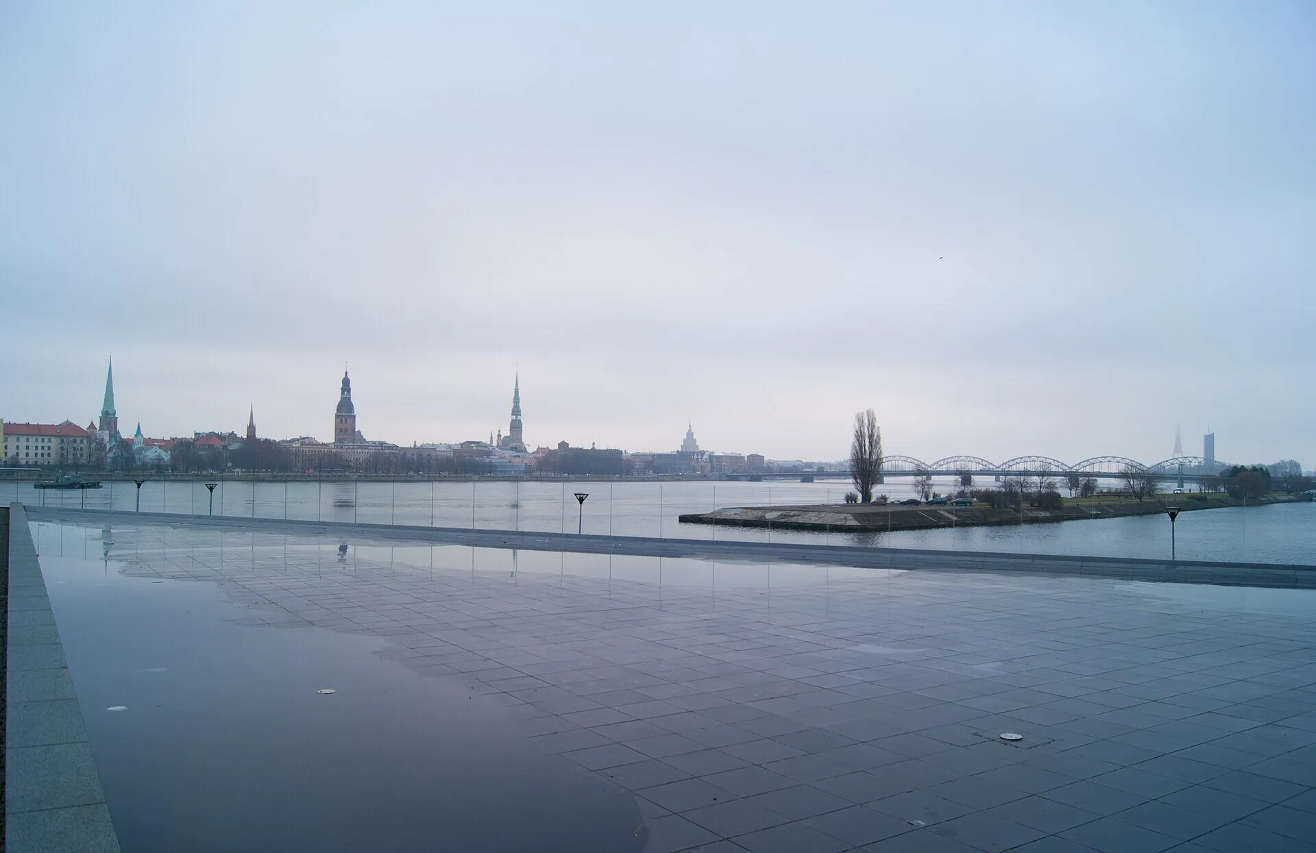 Riga Old Town skyline across the Daugava river, with church spires